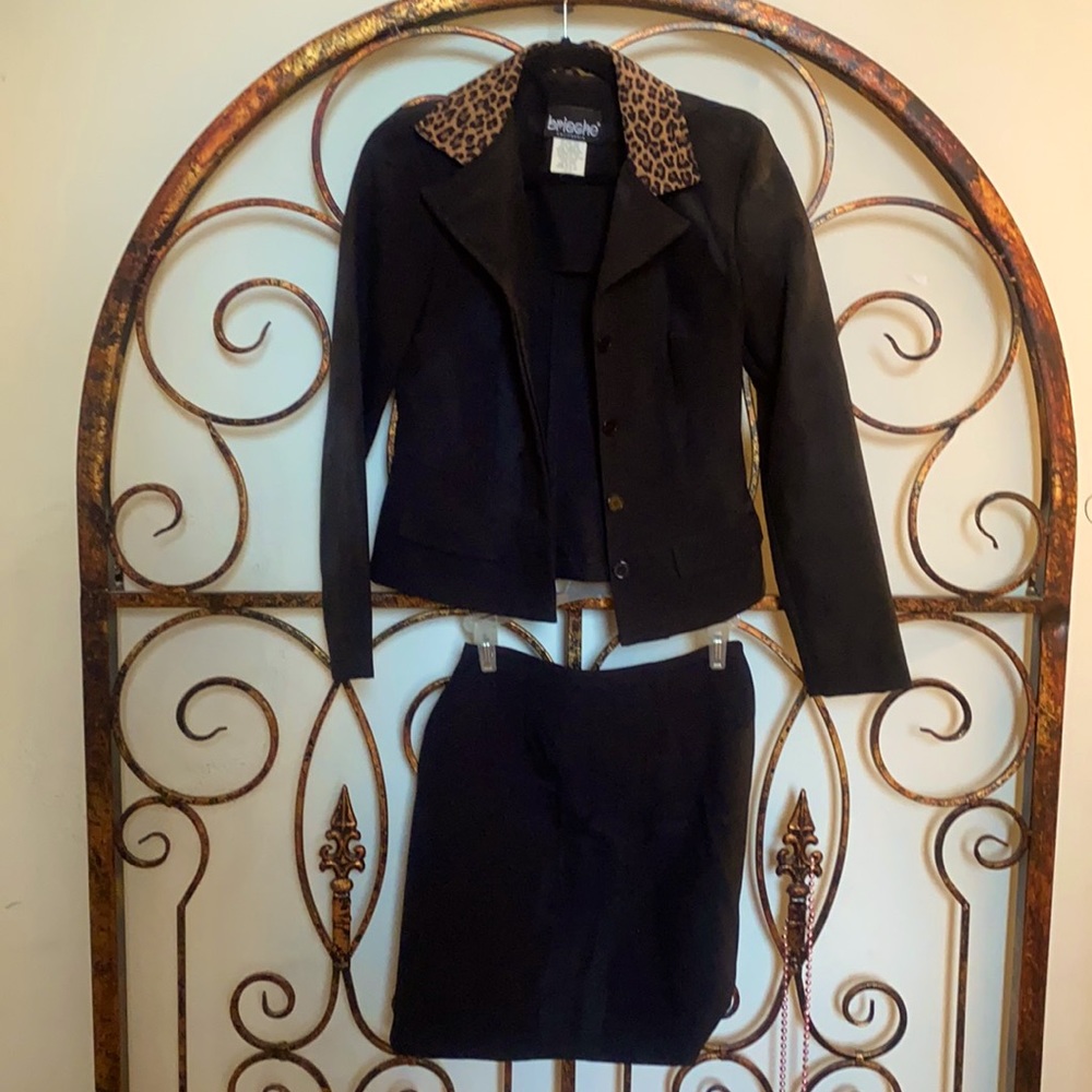 Two piece blazer and skirt set.